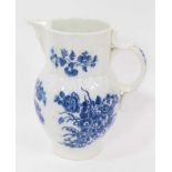 A Caughley blue and white cabbage leaf moulded jug with mask spout, decorated with bouquets of flowe