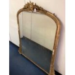 Victorian gilt gesso overmantel mirror, of arched form with pierced cartouche cresting, 134cm wide x