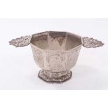 Antique Dutch white metal two handled bowl of octagonal form, with panels of engraved decoration, on