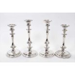 Two pairs of similar Victorian silver plated candlesticks with removable sconces and fluted columns