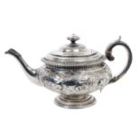 George IV Scottish silver teapot of cauldron form with central band of embossed floral and foliate d