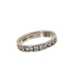 Diamond eternity ring with brilliant cut diamonds in platinum channel setting, estimated total diamo