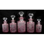 Rare set of five early 20th century Baccarat crystal graduated scent bottles with facet cut stoppers
