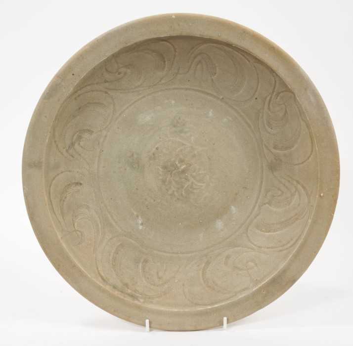 Chinese celadon dish, Yuan dynasty, from the Java shipwreck, with incised floral decoration, 32cm di