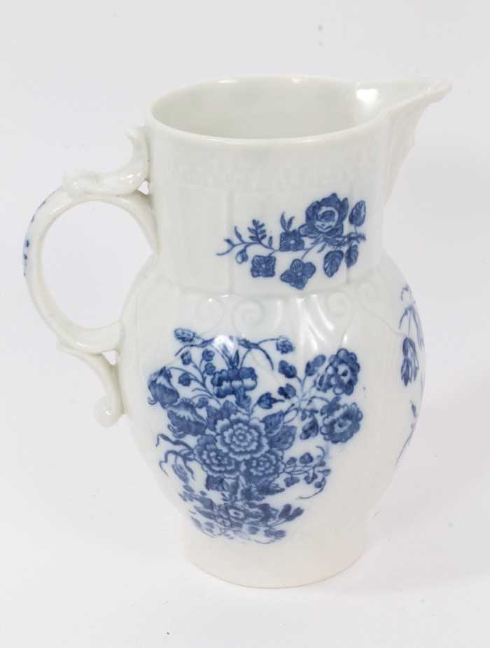 A Caughley blue and white cabbage leaf moulded jug with mask spout, decorated with bouquets of flowe - Image 3 of 5