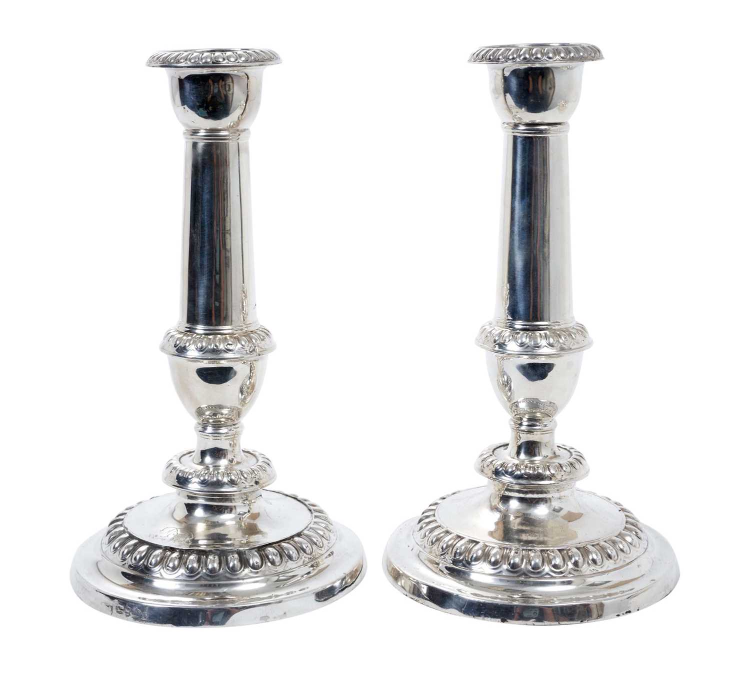 Pair of George III silver candlesticks with plain columns, removable sconces and egg and dart border