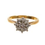 Diamond cluster ring with a flower head cluster of brilliant cut diamonds