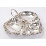 Early George V silver trefoil dish of lobed form, with crimped border and loop handle