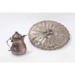 Egyptian white metal mirror of oval form with floral decoration and Turkish silver jug and cover of