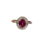 Ruby and diamond cluster ring in platinum claw setting on 18ct yellow gold shank