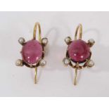 Pair of antique cabochon garnet and seed pearl earrings with an oval cabochon and four seed pearls i