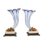 A pair of mid 19th century Bohemian blue flash glass cornucopia, on parcel gilt bronze and marble ba