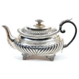 George III silver teapot of compressed baluster form, with half fluted decoration