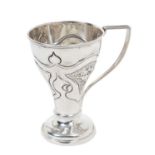 Edwardian silver christening mug of tapered form with embossed Art Nouveau style floral decoration,