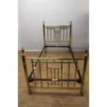 Pair of good quality Edwardian gilt brass single bedsteads, each with urn finials and lattice head a