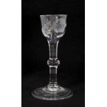 Georgian baluster stem wine glass, circa 1740, the ogee bowl with etched foliate decoration, with fo