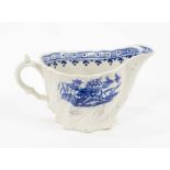 A Liverpool Pennington blue and white creamboat, circa 1790, of Low Chelsea Ewer form, printed with