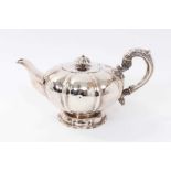 William IV silver teapot of melon form, with hinged cover and silver leaf mounted handle