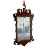 George II mahogany and gilt carved fret wall mirror.