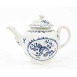 A Worcester blue and white teapot, circa 1780, decorated with the Fruit and Wreath pattern, crescent