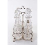 Victorian four bottle silver cruet frame, with quatrefoil base and central carrying handle