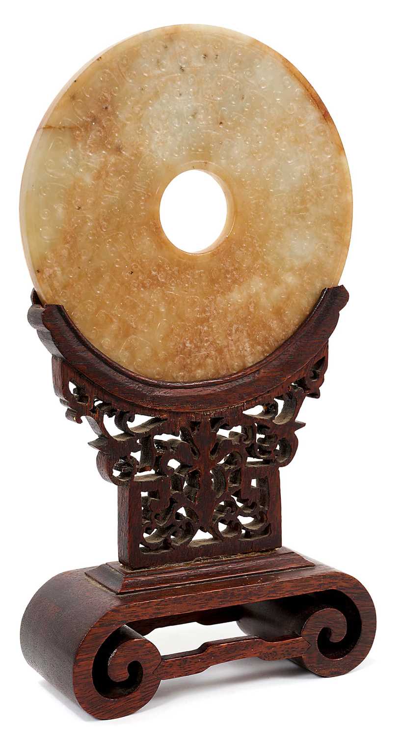 Antique Chinese jade bi-disc on carved wood stand