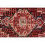Persian rug with central medallion.
