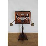 Early Victorian rosewood duet music stand, with twin adjustable pierced rests and flanking brass hin
