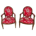 Rare pair of Louis XVI carved beech open armchairs