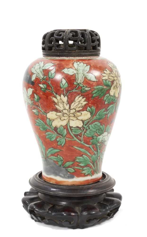 Chinese Wucai baluster jar, 17th century, decorated with a bird in flight amongst rockwork and flowe
