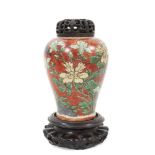 Chinese Wucai baluster jar, 17th century, decorated with a bird in flight amongst rockwork and flowe