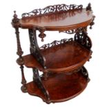 Victorian burr walnut three tier what not of shaped form with pierced fretwork supports