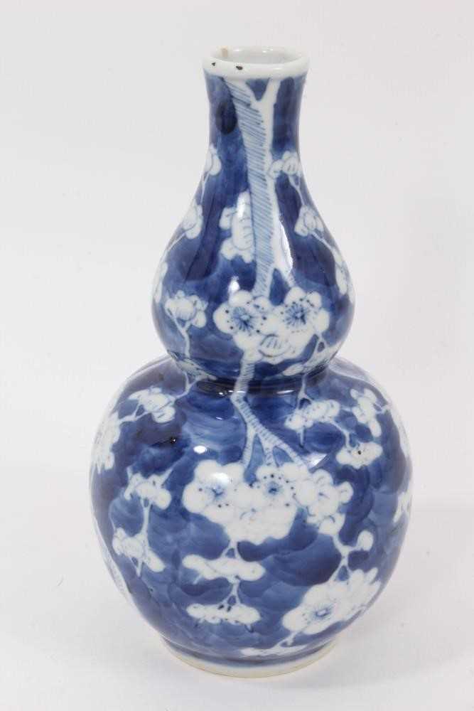 19th century Chinese blue and white double gourd vase, decorated with prunus blossom, four-character