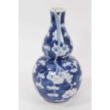 19th century Chinese blue and white double gourd vase, decorated with prunus blossom, four-character
