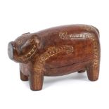 Massim culture Milne Bay Papua New Guinea carved wood pig with incised decoration inlaid with lime,