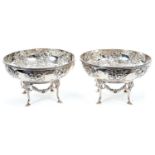 Pair Edwardian silver bowls with embossed floral decoration, with separate matching stands