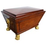 Fine Regency mahogany wine cooler of sarcophagus form with ormolu paw feet