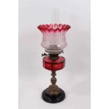Late Victorian oil lamp with cranberry tinted and etched glass shade with cranberry cut glass reserv