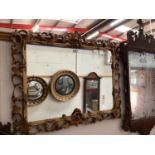 Rococo revival wall mirror, with arched rectangular plate in scrolling surround, 87 x 72cm