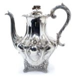 Victorian silver teapot of shaped baluster form, with engraved armorial, hinged domed cover