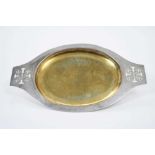 Fine George V silver communion dish of oval form with overall planished decoration, central gilded b