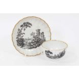 A Worcester fluted tea bowl and saucer, printed with ruins, circa 1770