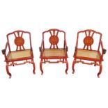 Set of three Chinese red lacquered dragon chairs