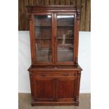 Late Victorian mahogany two height bookcase with shelved interior enclosed by two glazed doors with