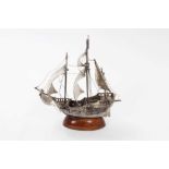 Contemporary silver model of a galleon at sail, mounted on oval mahogany base, marked to bow, 22.5cm