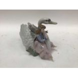 Lladro porcelain figure group - girl on Swan