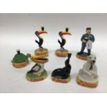 Seven various resin Guiness figurines, boxed