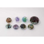 Eight Isle of Wight glass paperweights including a large Flower paperweight by Michael Harris circa.