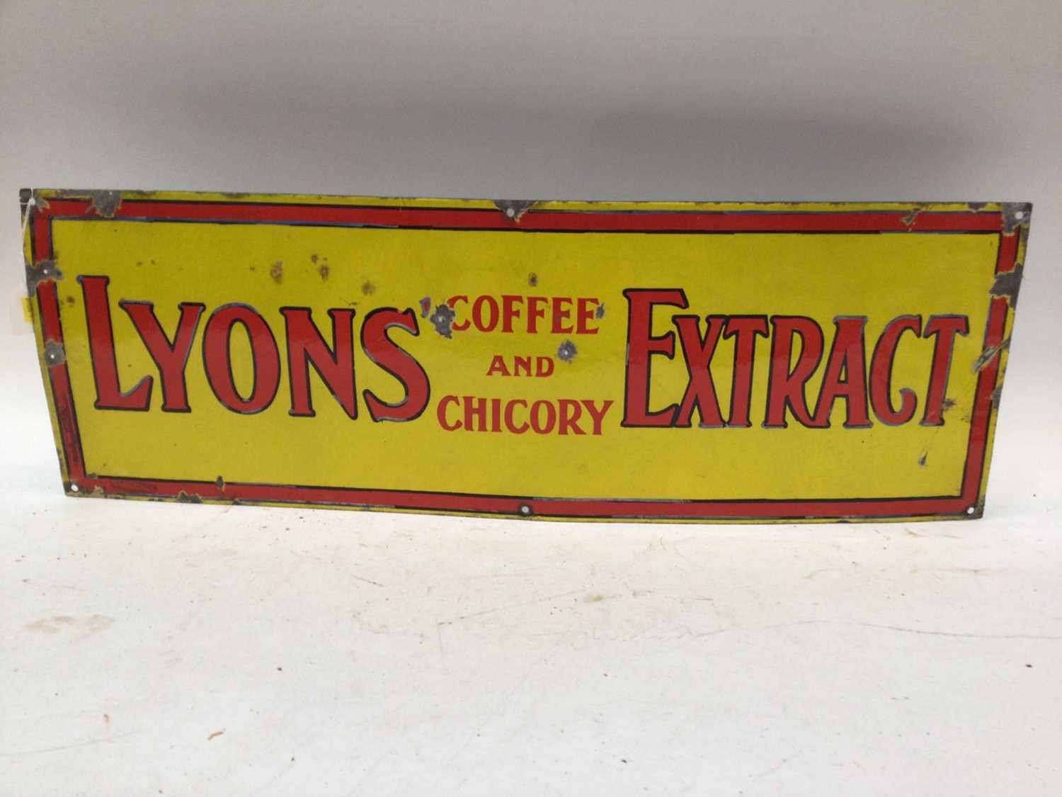 Vintage enamel sign - 'Lyons Coffee and Chicory Extract' - red on a yellow sign