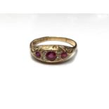 Edwardian 18ct gold ruby and diamond ring in carved scroll setting (Birmingham 1901)